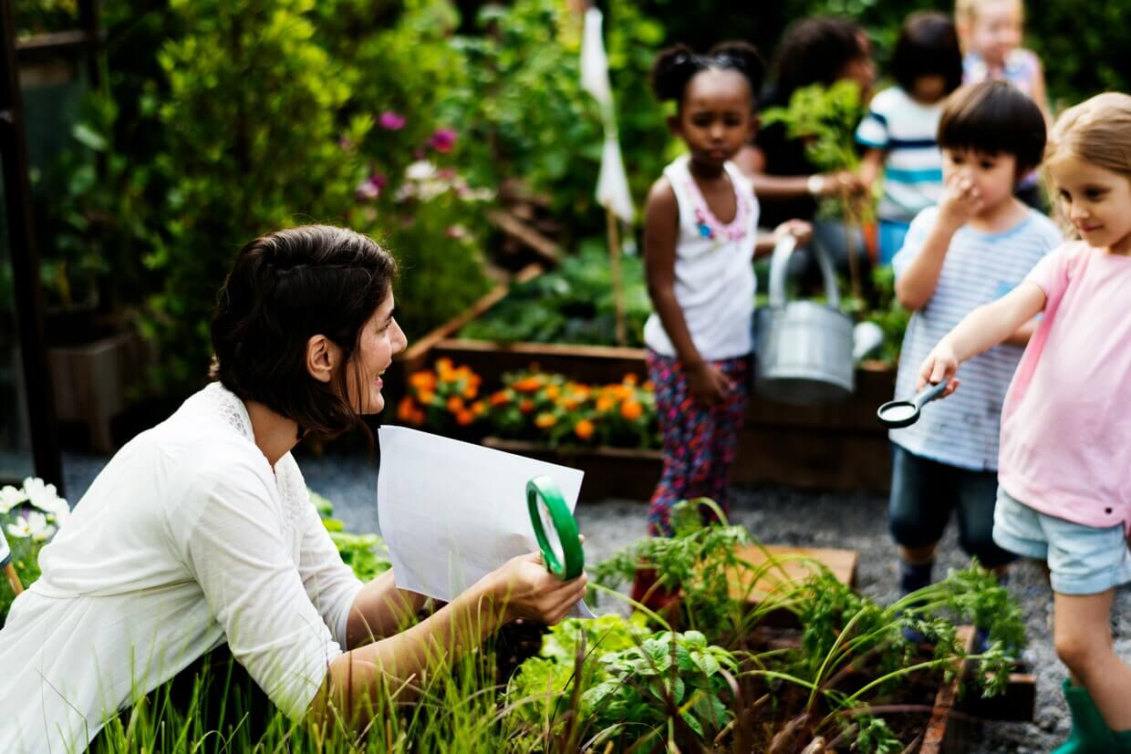Children exploring and learning together outside the classroom